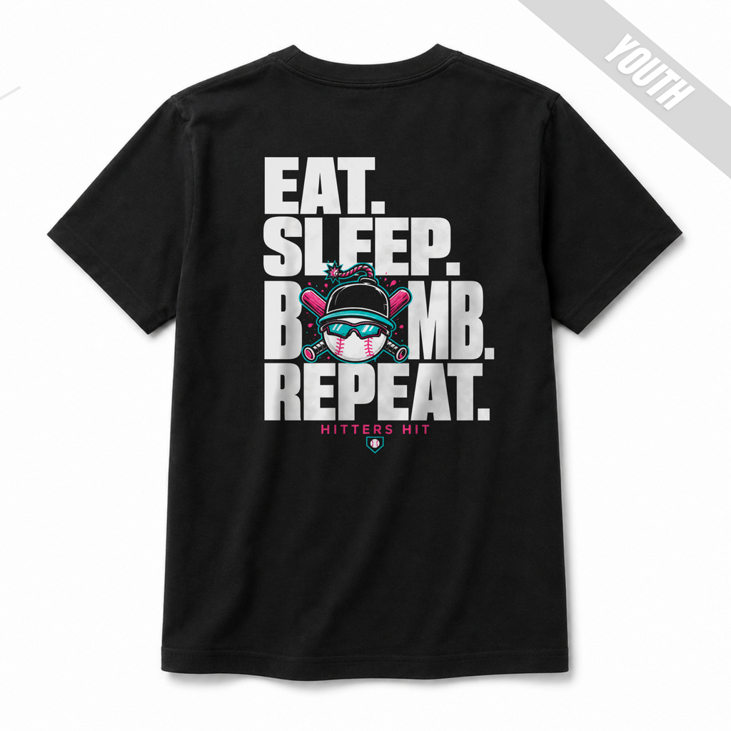 Back of black Built to Bomb youth baseball T-shirt featuring the Eat Sleep Bomb Repeat graphic in white, pink and teal.